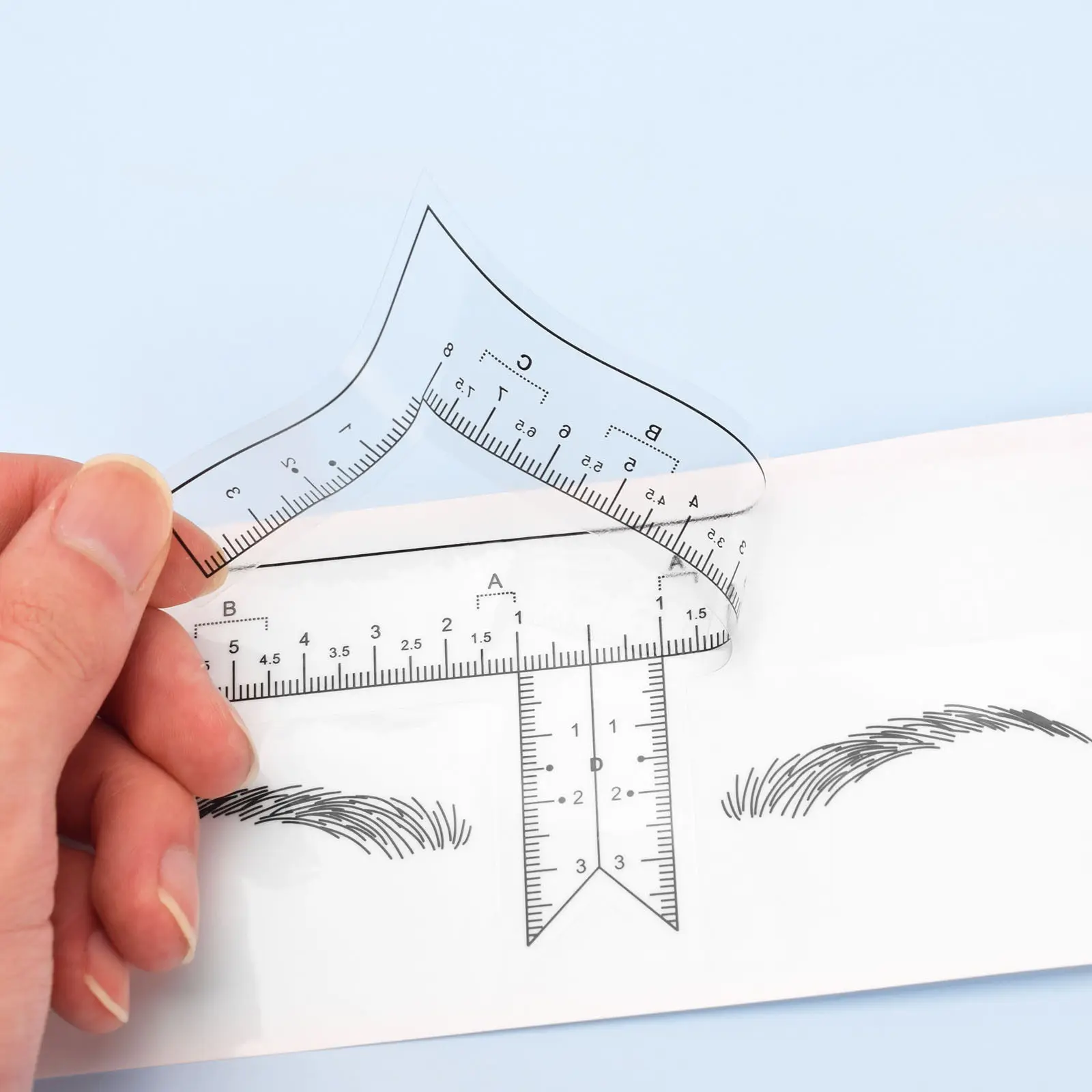 

10 шт. одноразовая вспомогательная линейка для бровей, линейка для дизайна в форме бровей, прозрачная линейка для вышивки с клейким узором