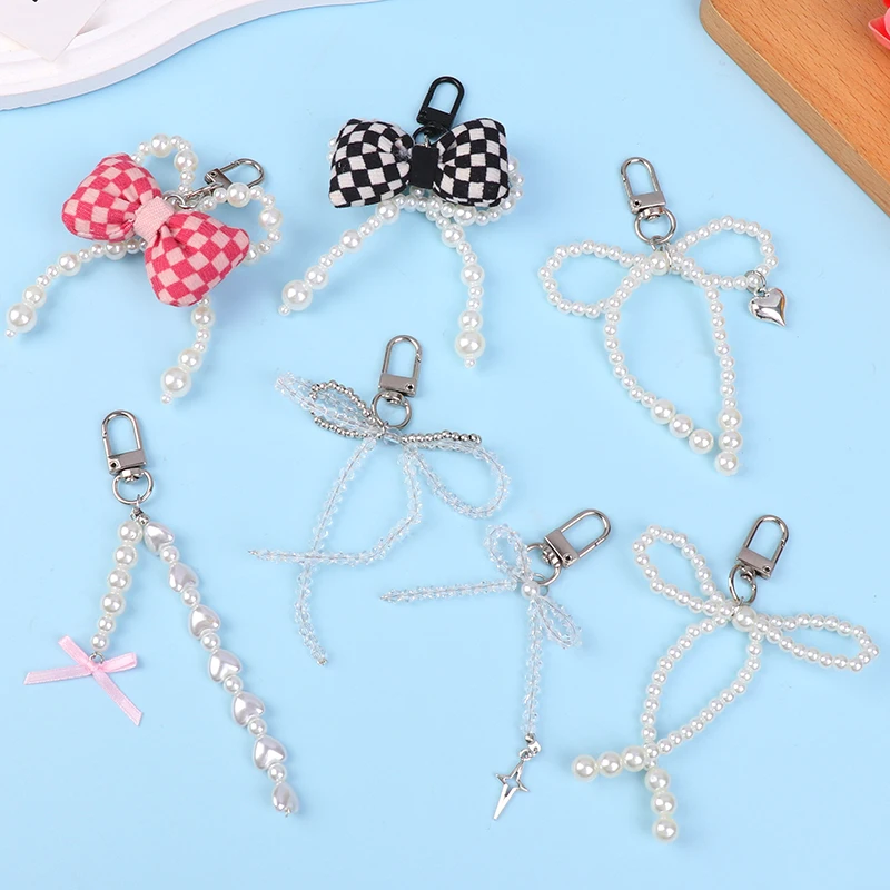 

Korean Pearl Bow Phone Lanyard Sweet Bowknot Phone Chain Keyring Fashion Bag Pendant Earphone Camera Charms For Girl Gifts