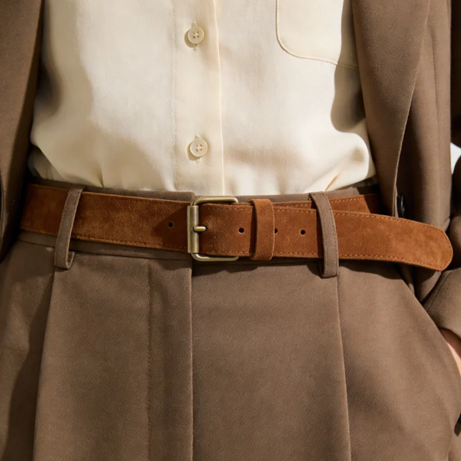 Retro-style suede leather belt with simple button closure design. Women's formal suit accessory.