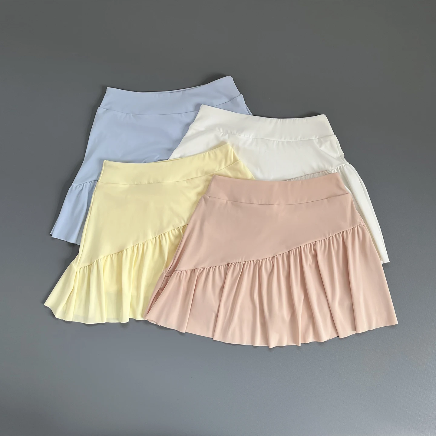 Jupe-short athlétique taille haute à volants pour femme avec short intégré, séchage rapide, respirante, pour le tennis, le fitness, la course et l'entraînement sportif