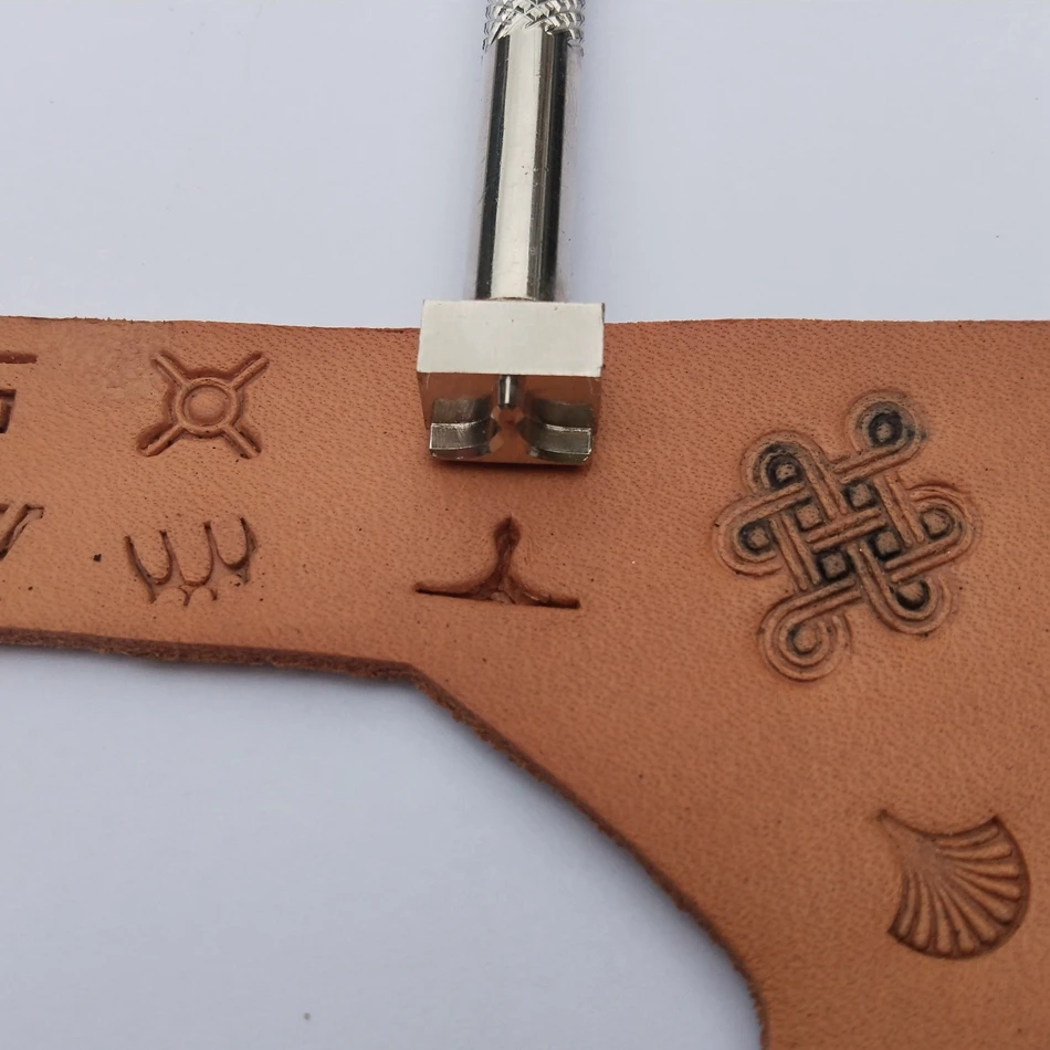 Leathercraft hardware tools, precision steel engraving and embossing tools, decorative geometric border patterns.