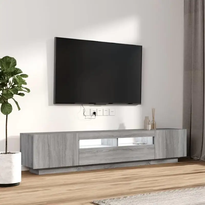 Mueble para TV de madera de ingeniería con iluminación RGB regulable. Dispone de un amplio espacio de almacenamiento, una estructura robusta y un diseño modular separable. Requiere montaje; fuente de alimentación USB no incluida.