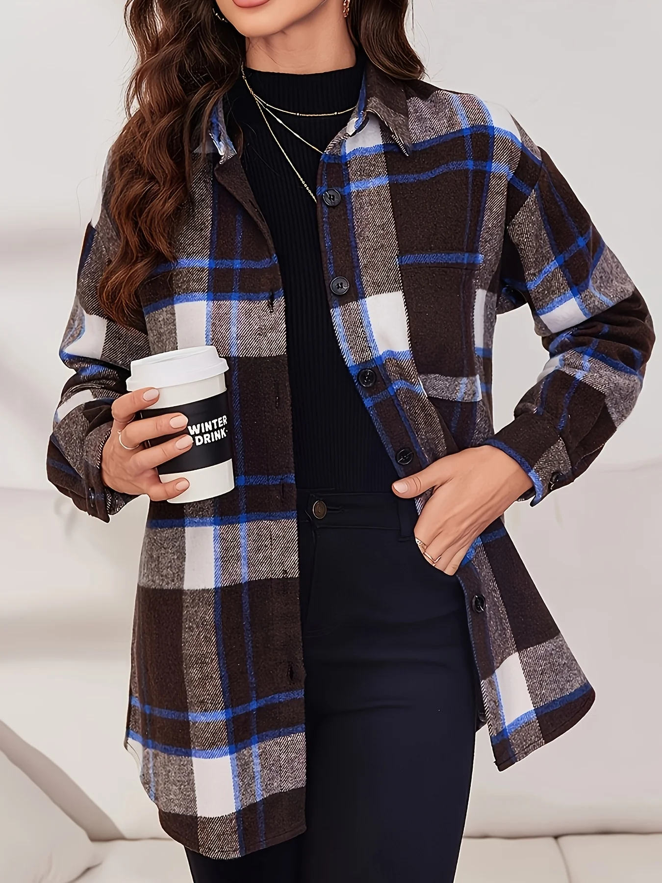 

A medium-length shirt with a brown-blue check pattern, button design, long sleeves for warmth and comfort.