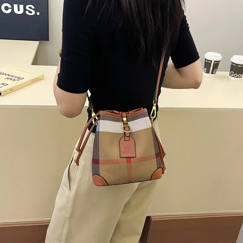 

Bespoke Chic Bucket Crossbody Bag Subtle Laser Cut Accent Rare Design for Classy Travels Understated Luxury