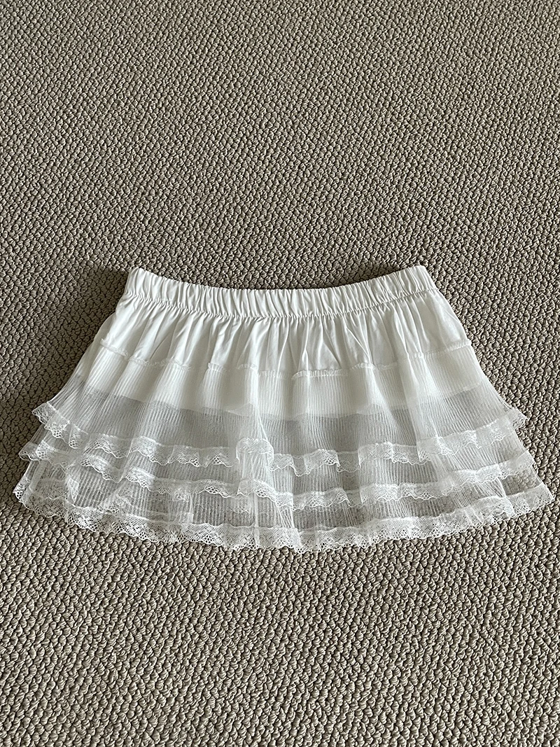 Falda de media capa con ribete de encaje INS, ropa de capas blancas a la moda para mujer, falda corta envolvente de corte a de Lolita dulce para primavera, ropa de calle