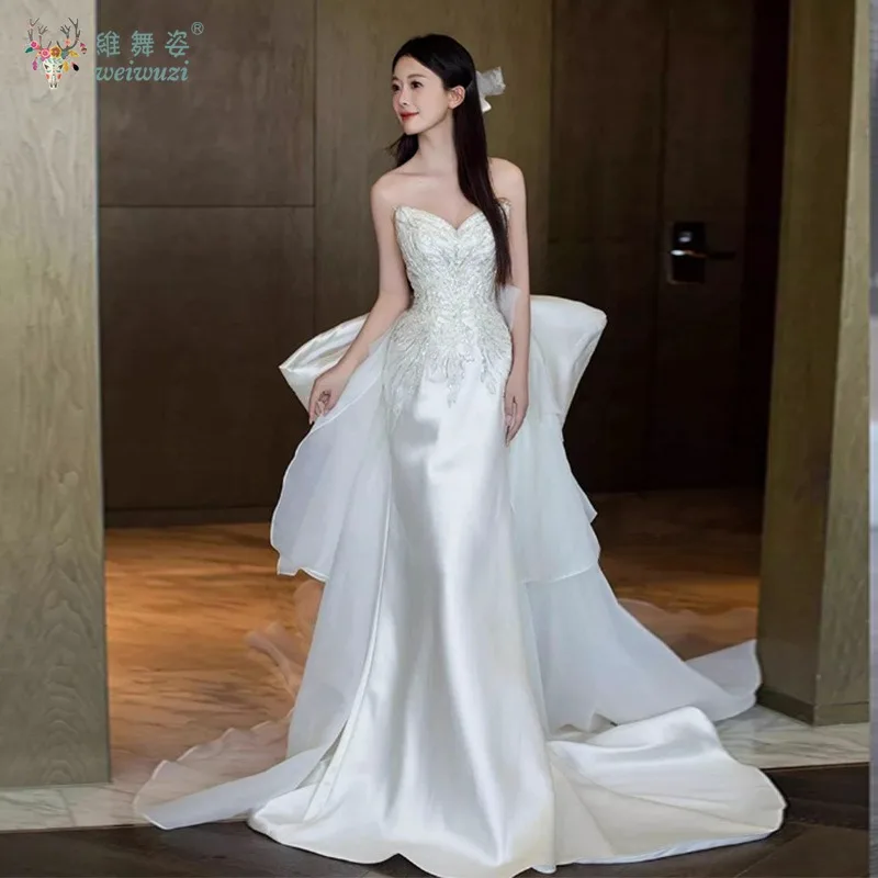 2025 nuevo vestido de novia de satén de estilo francés, vestido de novia de cola grande con lazo bordado de cuentas hecho a mano exquisito sin tirantes a la moda