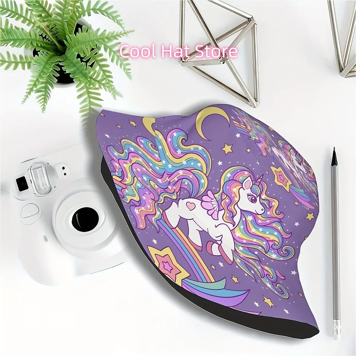 A Single Piece of a Whimsical White Unicorn Bucket Hat Featuring a Starry Design Amidst Rainbows, Perfect for Outdoor Activities