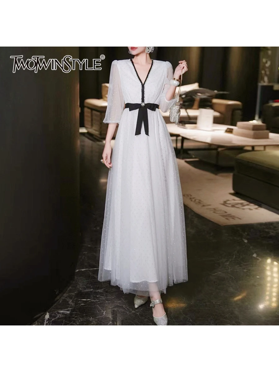 

TWOTWINSTYLE Solid Spliced Bownknot Loose Long Dresses For Women V Neck Long Sleeve High Waist Temperament Long Dress Female New