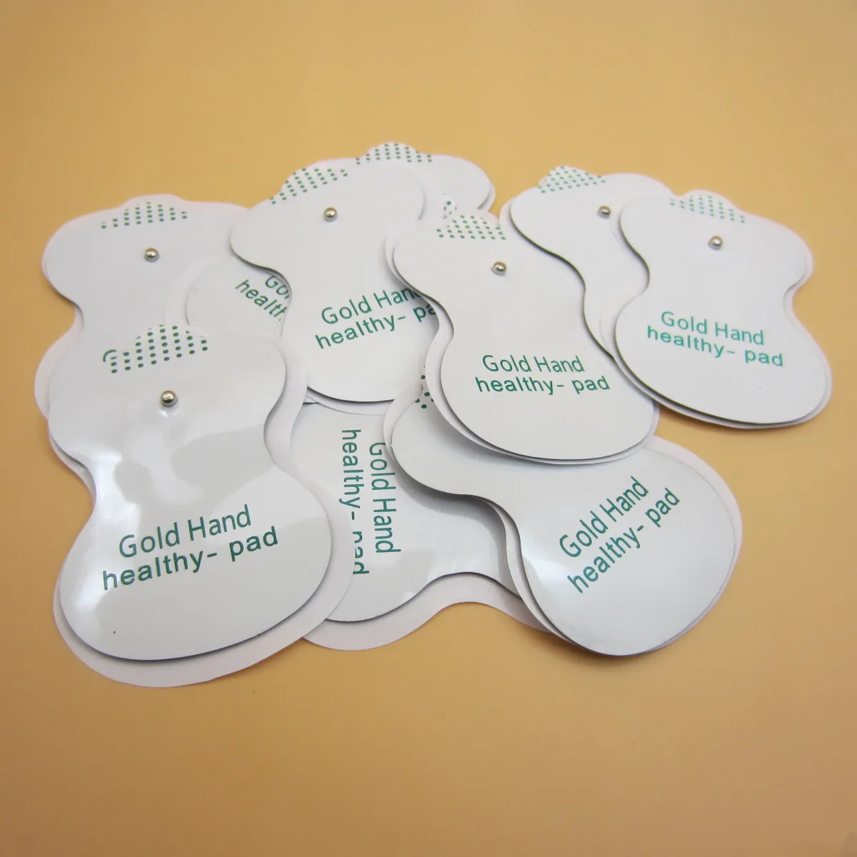 50/100pcs Electrotherapy Gold Hand Healthy Pads for Tens EMS Electrical Stimulation Massager with 3.5mm Stud