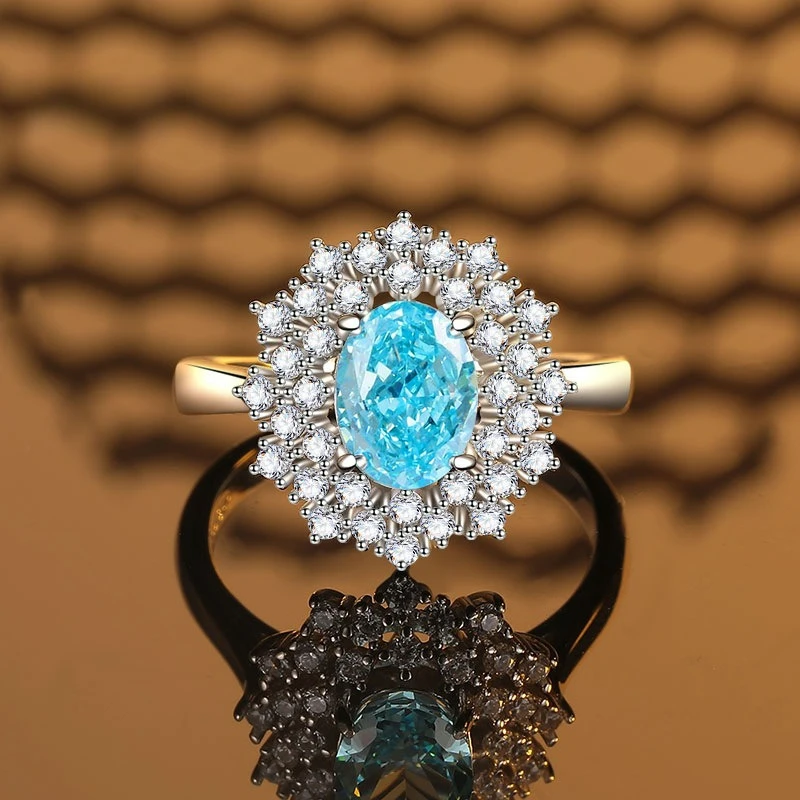 

PT950 Platinum Egg Shaped Sea Blue Ring with Two Layers of Small Broken Diamonds, 4 Carats Main Stone, 6 * 8mm