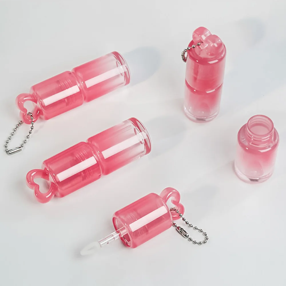 ハート型のグラデーションカラーリップグロスチューブ、大きなワンドブラシ付きリップオイルボトル、空のリップグロスチューブ、リップスティックボトル容器