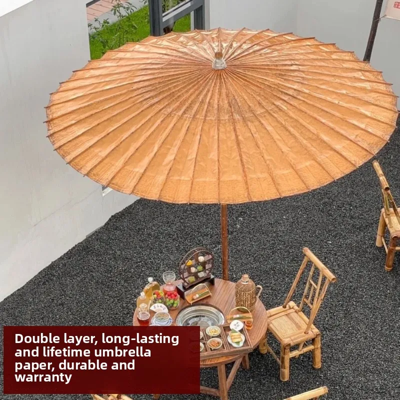Furnace making tea outdoor, antique oil paper, Chinese garden rain and sun umbrella