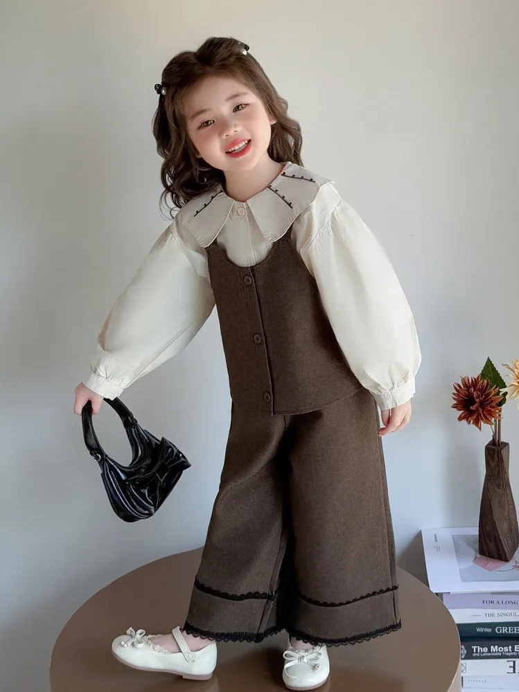 ชุดเสื้อกั๊กเด็กผู้หญิง ชุดฤดูใบไม้ร่วง 2025 ใหม่ทันสมัยและแฟชั่น เสื้อคอปกปีเตอร์แพนสำหรับเด็กผู้หญิง ชุดสามชิ้นหวานๆ สำหรับฤดูใบไม้ร่วง