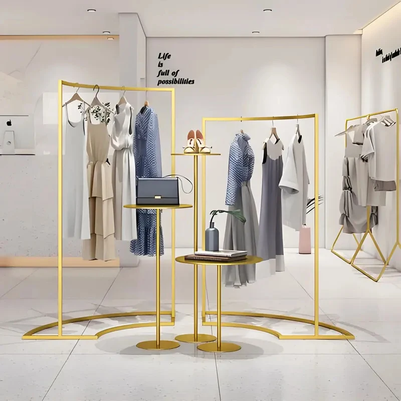 custom.New Design Luxurious Wall Mounted Shiny Gold Stainless Steel Customize Clothes Display Rack Clothing Store