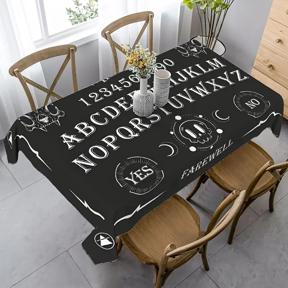 A Halloween or Dia de los Muertos party tablecloth with an aura board print. The party decoration is quite interesting.