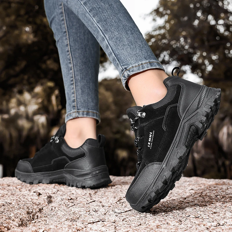 

A pair of sports outdoor hiking shoes, workwear, leather lace up couple hiking boots, vacation outdoor, four season style