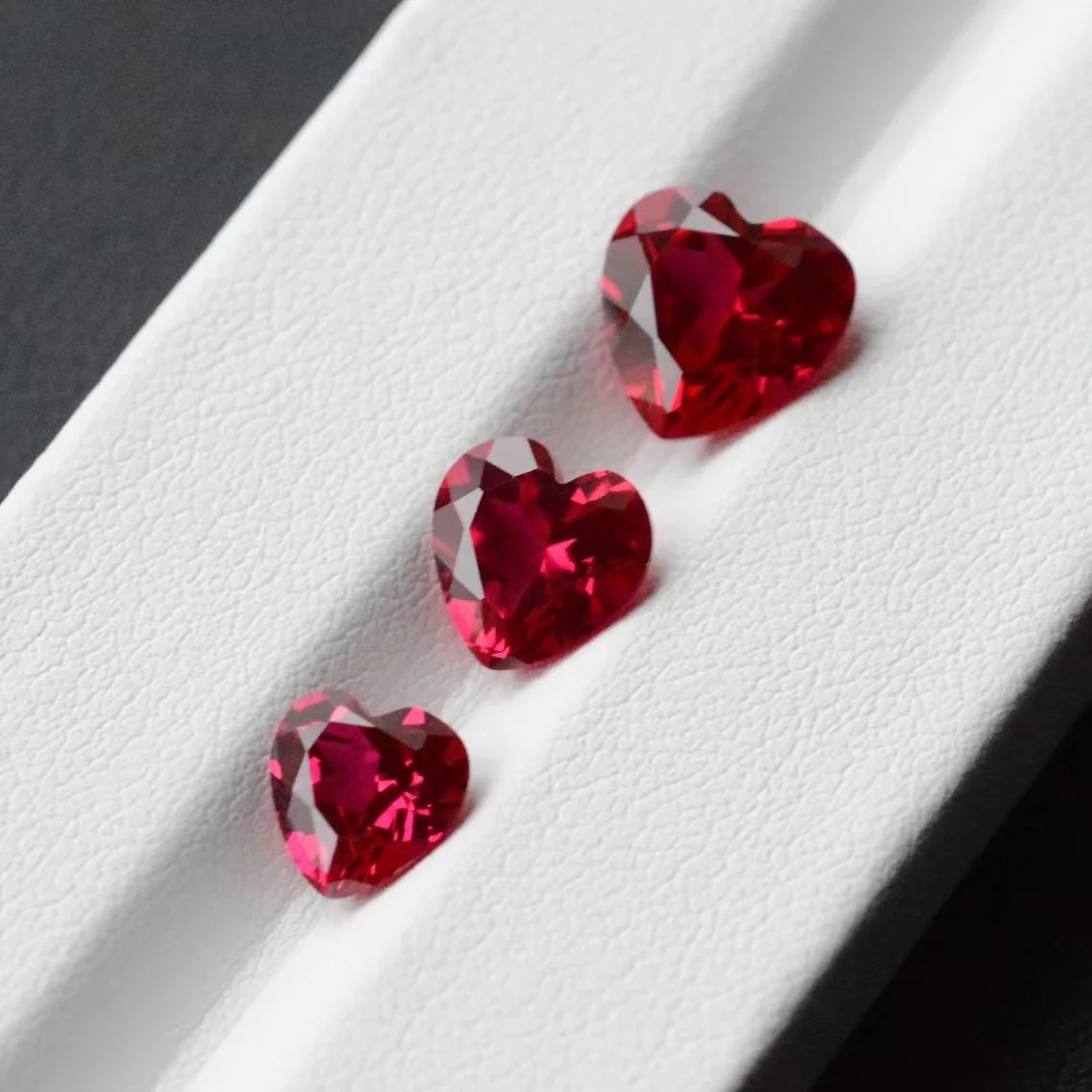 Cultivation ruby laboratory to grow synthetic ruby heart-shaped faceted jewelry with bare stone inlay