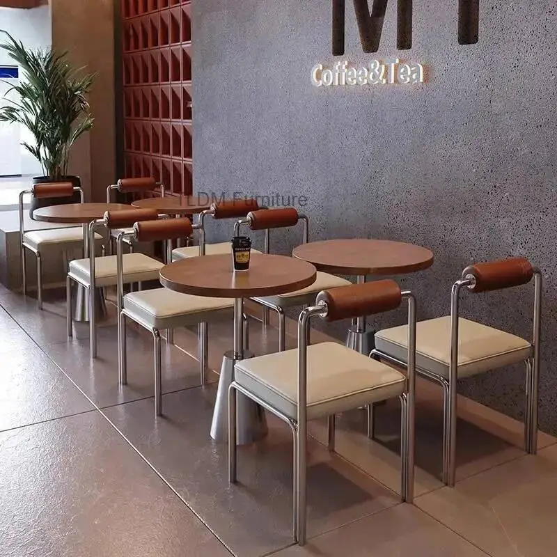 An Afternoon Tea-inspired Coffee Shop Featuring Comfortable Wooden and Stainless Steel Chairs for Relaxation. Dining Room Chairs