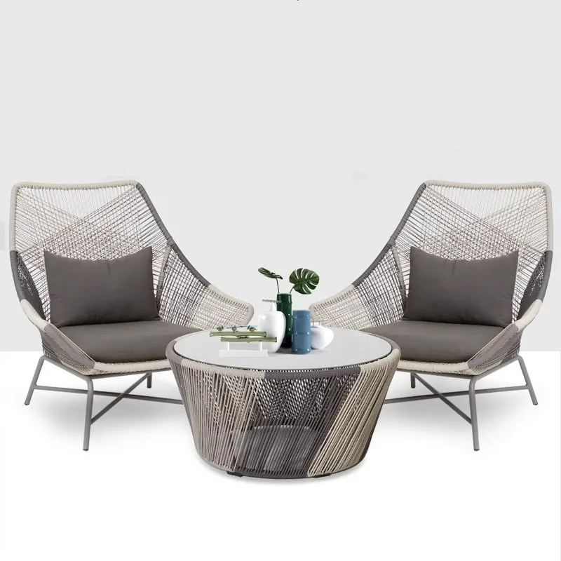 Nordic modern outdoor three-piece rattan table and chair sofa set is fashionable and casual, suitable for balconies, courtyards