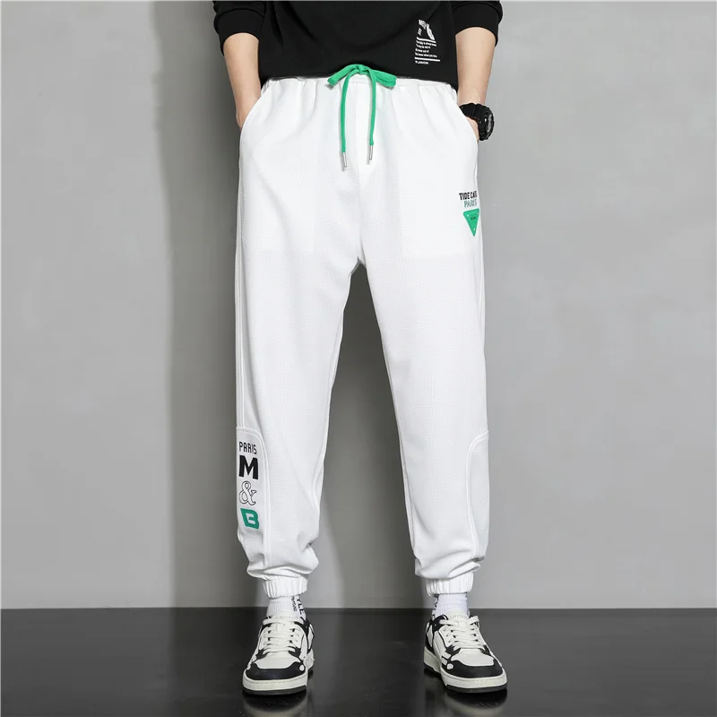 

2023 Spring New Men's Leggings Casual Pants Hong Kong Style Versatile Fashion Men's Loose Sports Pants M-5XL