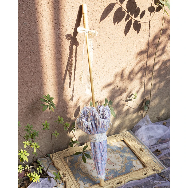 مظلة دانتيل عتيقة بمقبض طويل