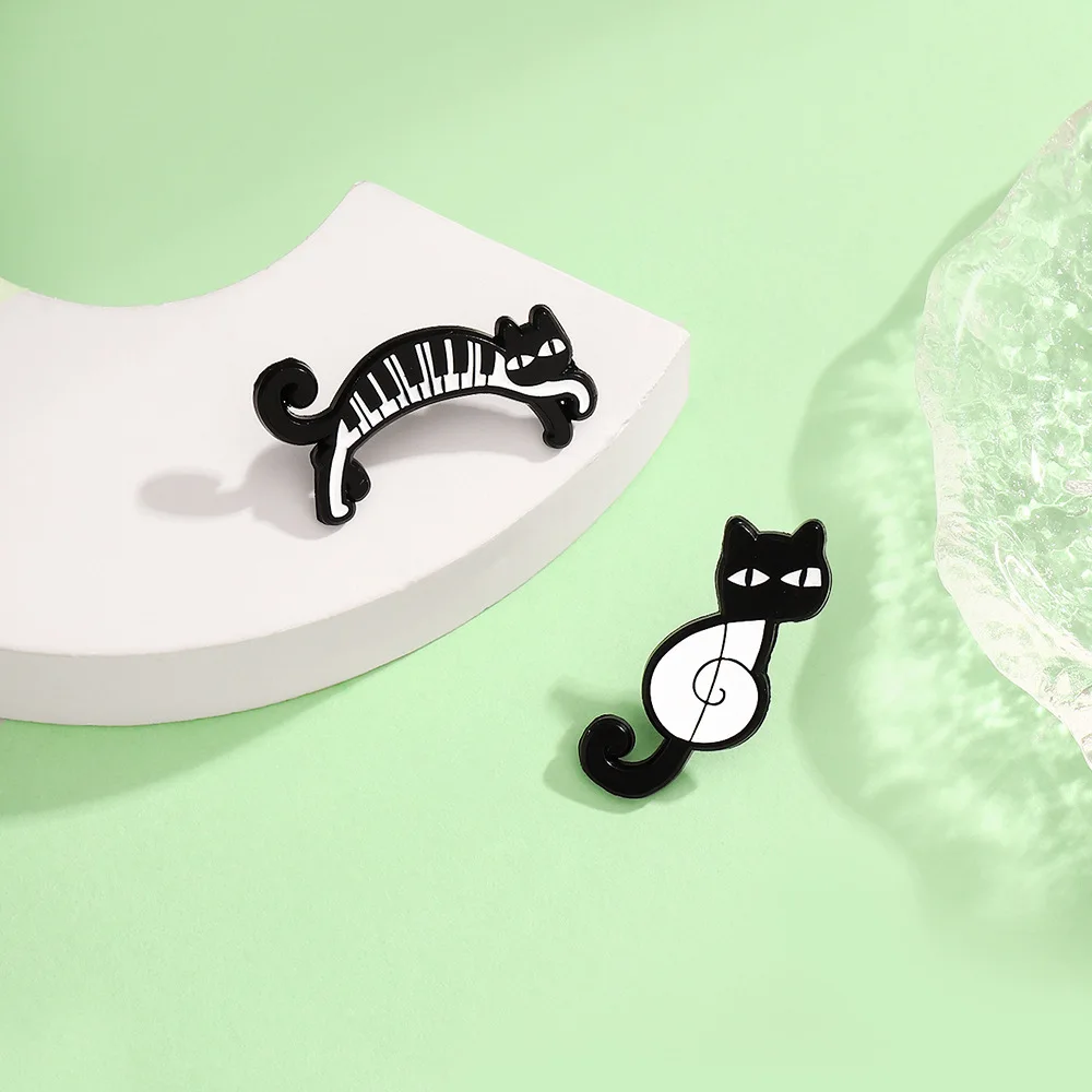 Black and white piano keys, happy cat, connected yoga movements, funny cat notes, creative cat, animal brooch