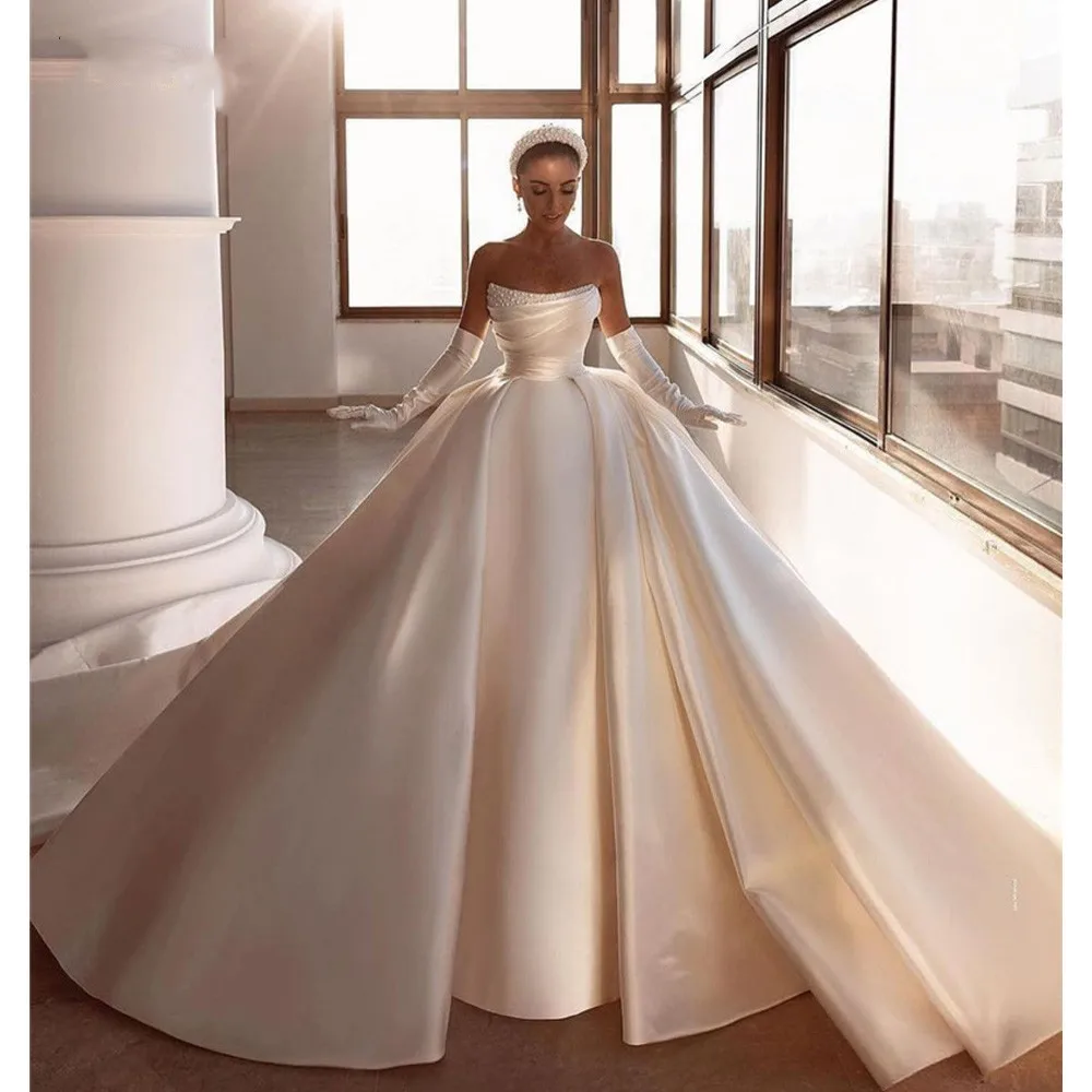 Dubai Arabic Wedding Dresses For Women Strapless Sleeveless Pearls Big Bow Long Train Bridal Gown Robe De Mariée Customized