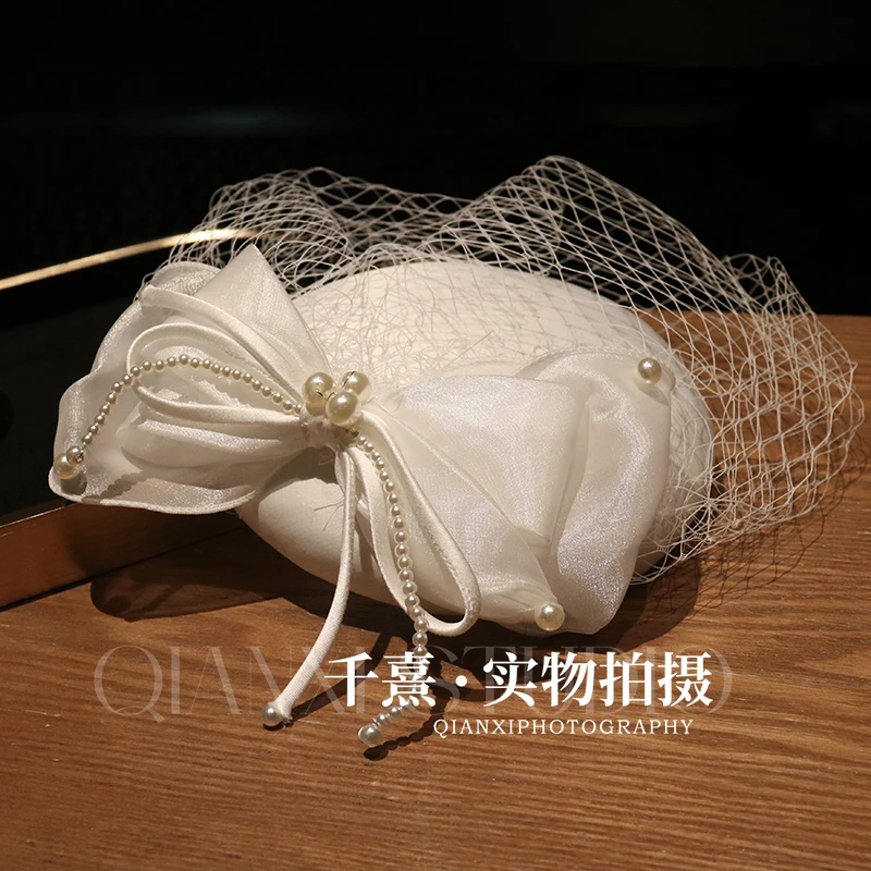 

2025 French Style Big Bow Pearls Fascinator Hat for Women Elegant Bride Wedding Hat Face Veil Hair Clip Banquet Party Headwear