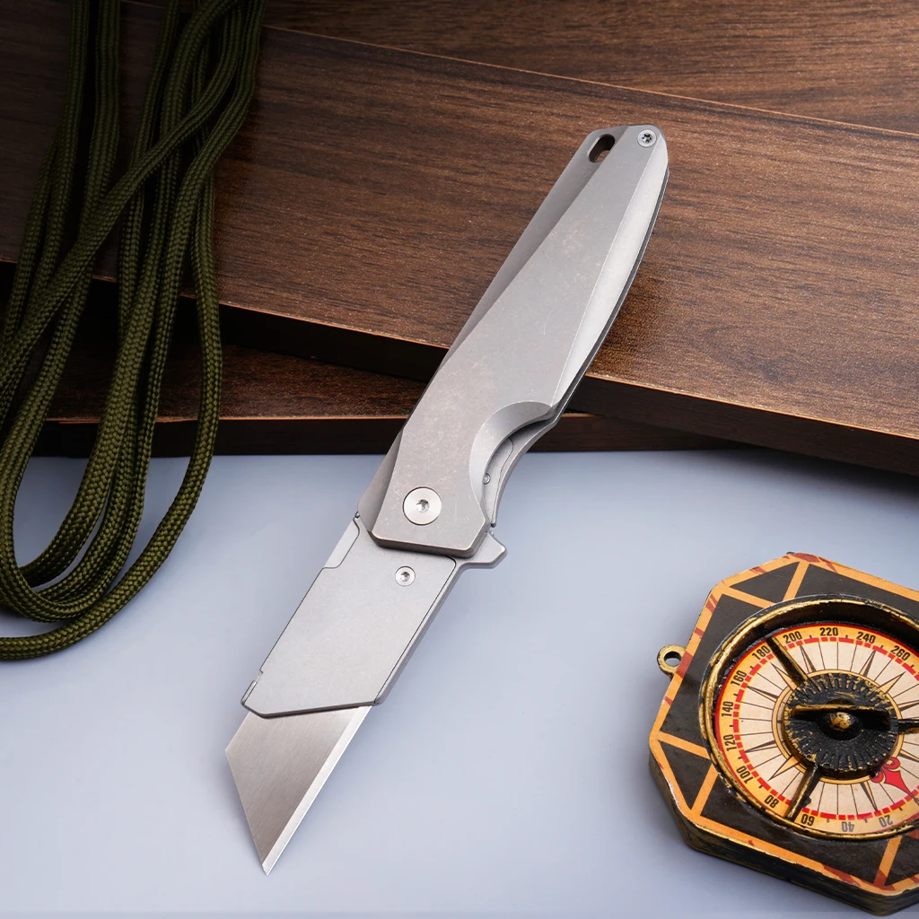 EDC knife. Titanium alloy folding knife. The blade can be replaced