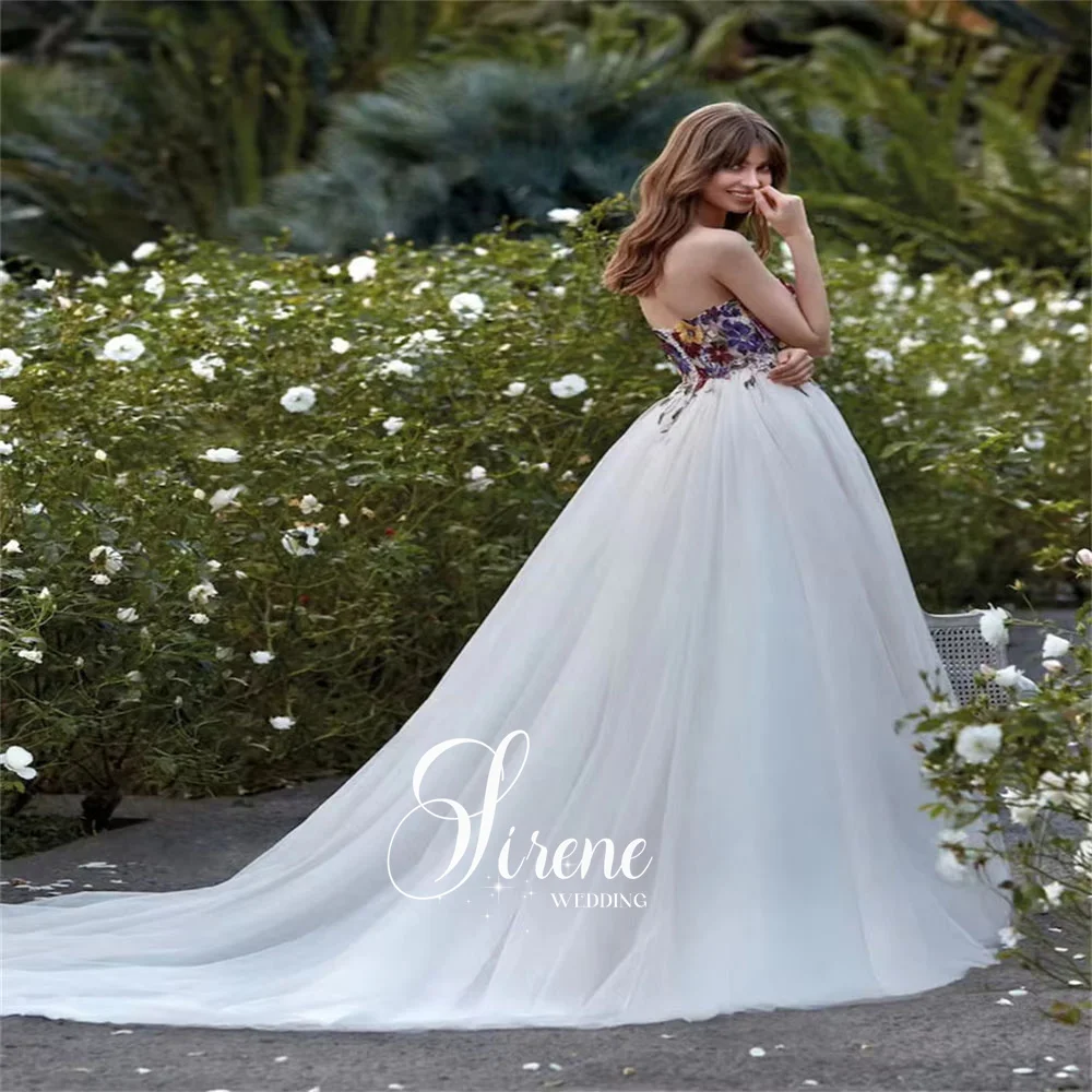 فساتين زفاف سيرين على شكل قلب بدون أكمام على شكل حرف a من التل والزهور بدون حمالات مزينة بطول الأرض بدون ظهر فستان حفلة موسيقية مخصص