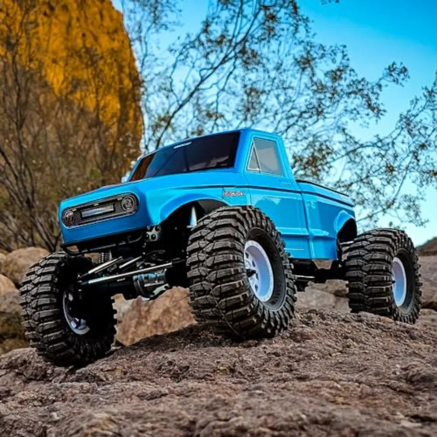 RC rock crawler truck for off-road terrain, aluminum alloy chassis, black color, portal axles and 4WD for extreme traction