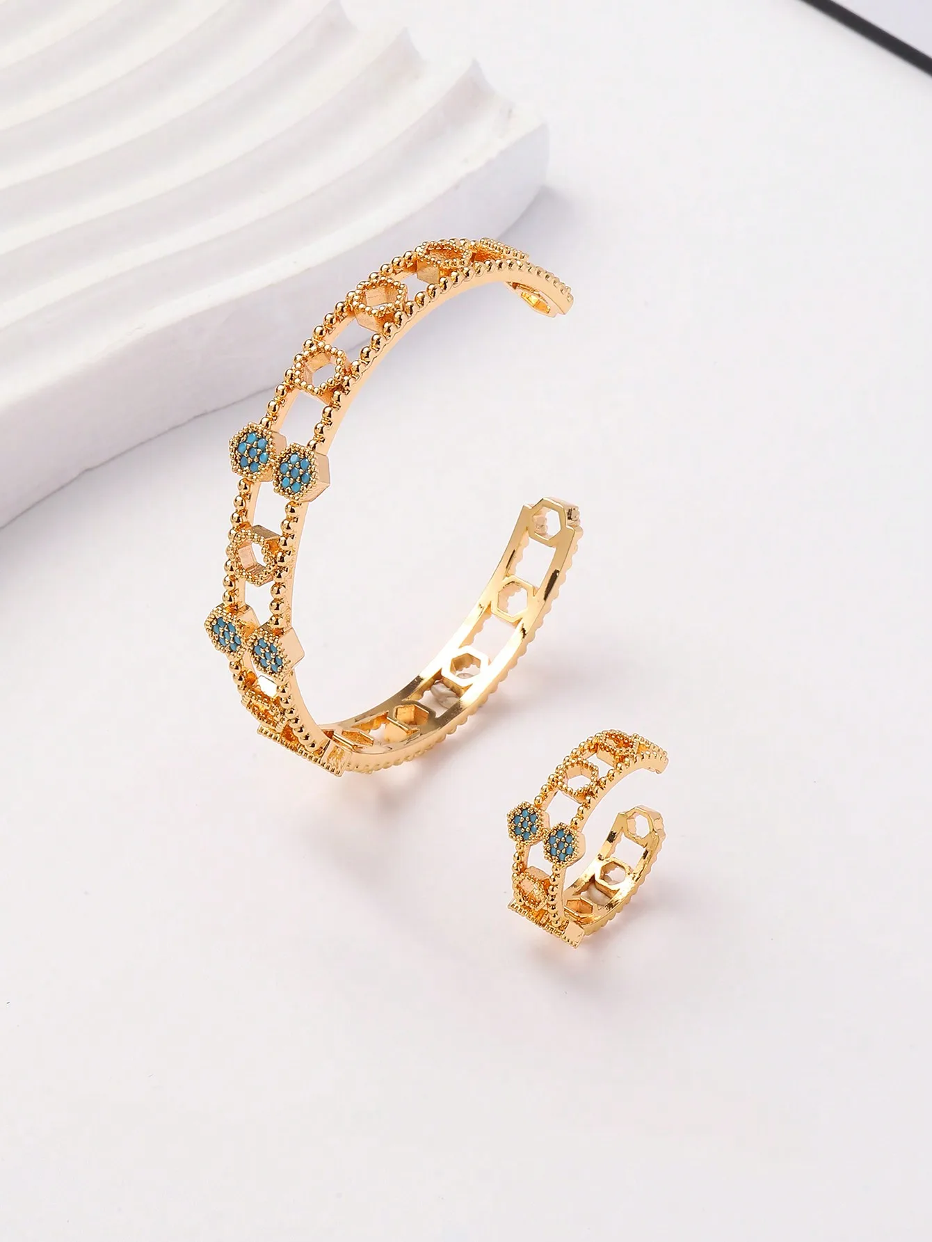 A set of women's new Europe and the United States 14K gold-plated copper hexagonal hollow micro-inlaid zircon bracelet ring set