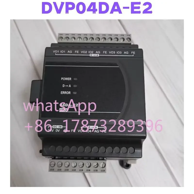 

Second-hand DVP04DA-E2 PLC Expansion Module Tested OK