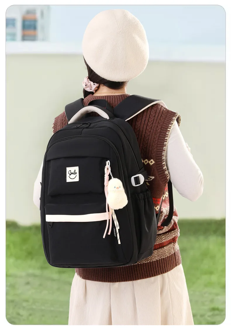 2026 Elementary School Students' Smiling Backpack Lightweight Middle School Students school bag Large Capacity Travel Backpacks