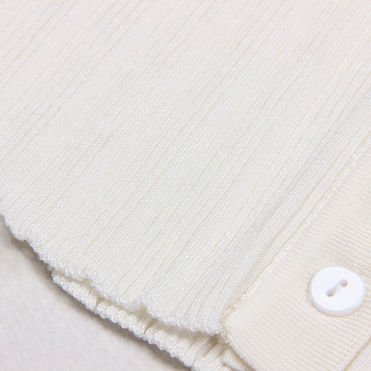 Primavera y otoño nuevo estilo moda temperamento viajero alta calidad hielo seda tejido manga larga cuello cárdigan Top Coat