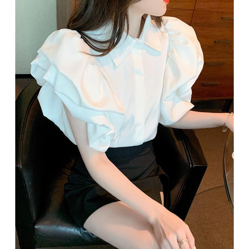 Camicia abbottonata con Design a maniche corte a sbuffo Vintage alla moda da donna elegante camicetta bianca nera dolce elegante con risvolto Casual