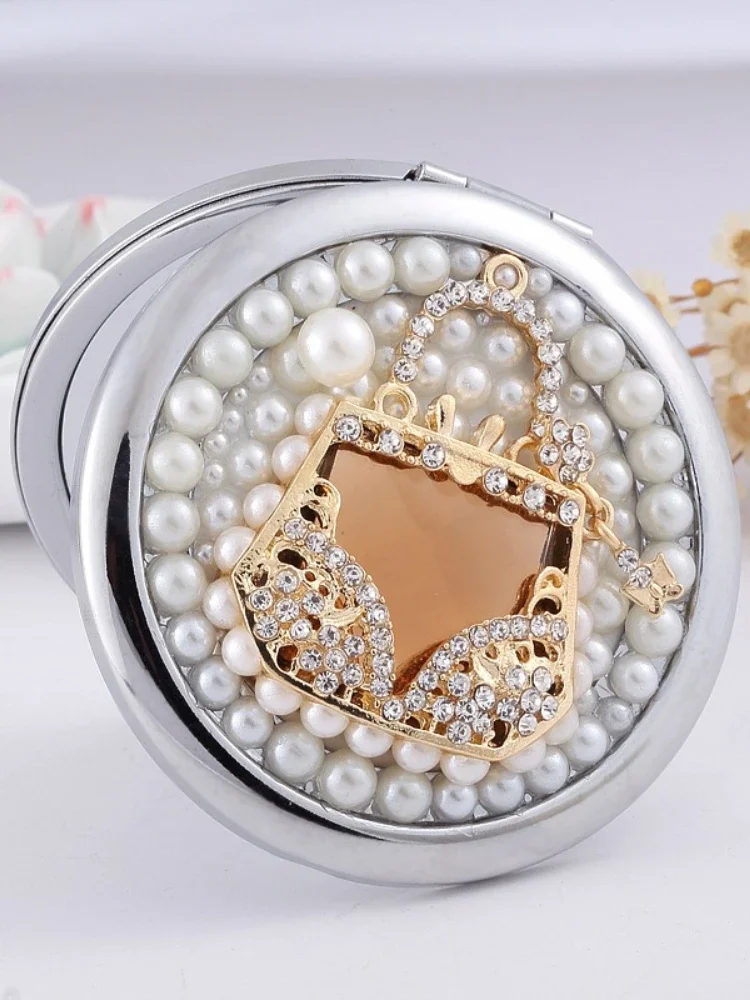 Exquisito Mini espejo de bolsillo redondo pequeño de lujo con bolsa de diamantes, espejo portátil plegable de doble cara, cosmético agrandado