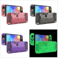 eXtremeRate Juego completo de carcasa de repuesto para Nintendo Switch OLED, placa trasera y soporte, carcasa Joycon con botones coloridos