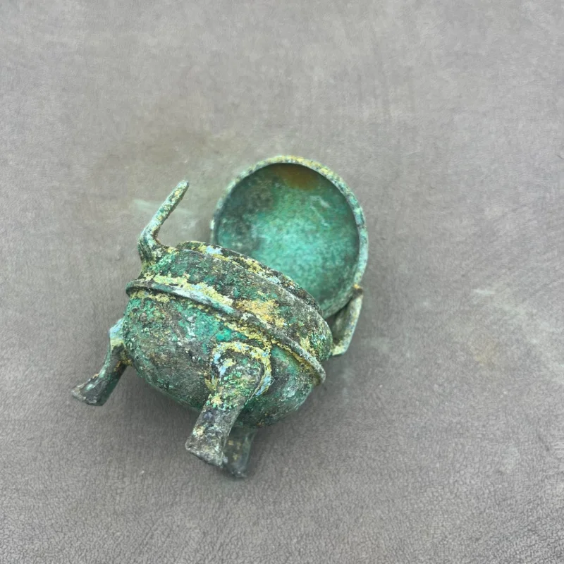 Unearthed Han Dynasty vessels, small cauldrons, ancient ornaments, and bronze handicrafts