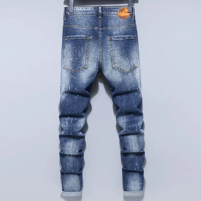 Men Light‑Blue Horizontal Whisker Wash Multi‑Position Ripped White Paint Splatter Stretch Skinny Denim Jeans Hip‑Hop Streetwear