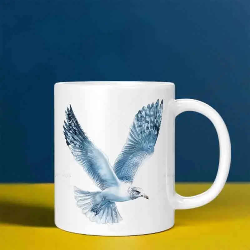 This mug features a soaring seagull design and is machine washable, making it suitable for use in the kitchen and office.