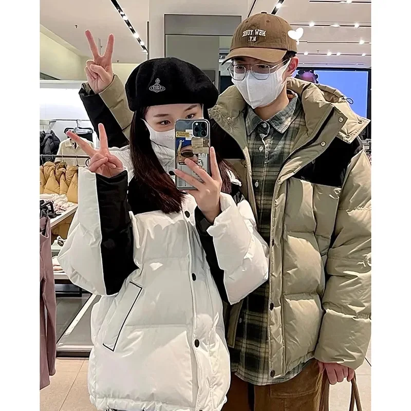 2023 Winter neue Baumwolle gepolsterte Jacke Damen kurze Kapuze Farbe passend koreanische lose verdickte Paar Herren und Damen Outwear