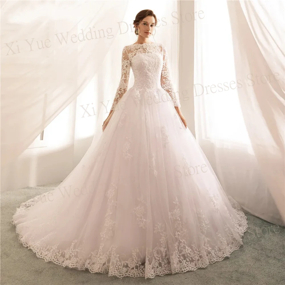 

Arabic Dubai Exquisite Tulle Wedding Dresses New Back Buttons Illusion Bride Gowns Court Train Long Sleeve A Line Appliques Lace