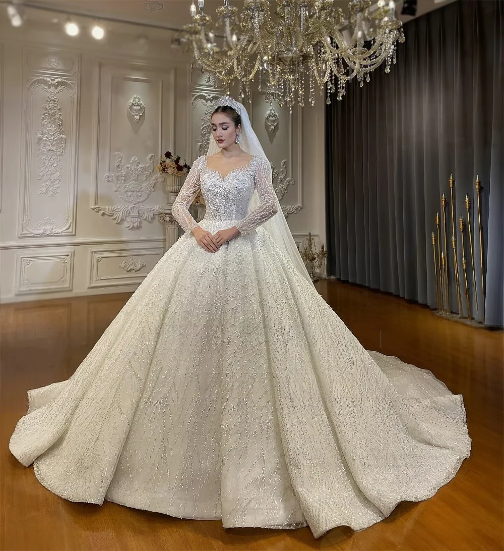 Customized Luxury Sparkly Beaded Wedding Dress Sweetheart Neck Long Sleeves Lace Ball Gown Bridal Dress Amanda Novias Official