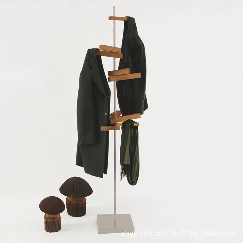 Light luxury minimalist solid wood rotating stainless steel floor art coat rack