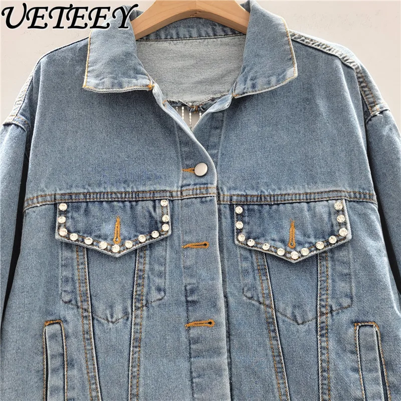 سترة دينم مزينة بحجر الراين على شكل قلب للنساء عصرية لخريف 2025 معطف جينز قصير أنيق فضفاض للتخسيس