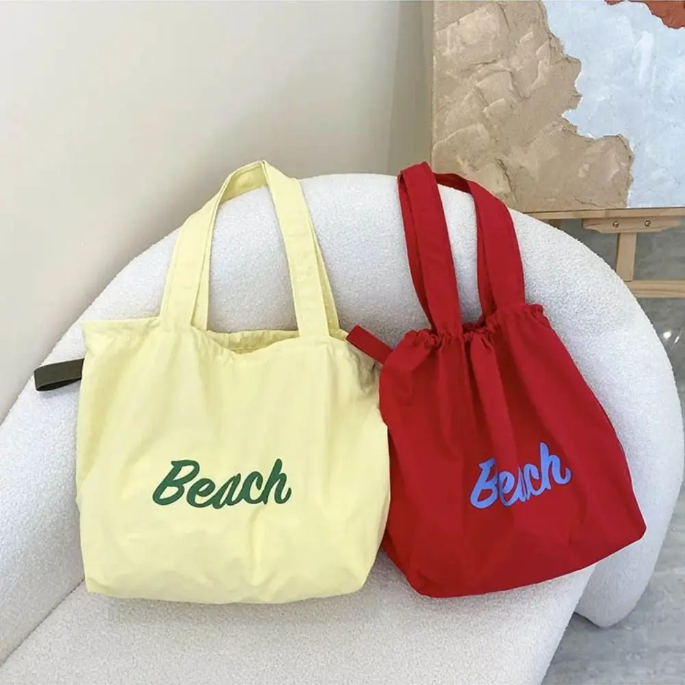 

Fashionable Drawstring Shopping Handbag Large Capacity Letter Printed Beach Bag Lightweight Canvas Tote Bag Work