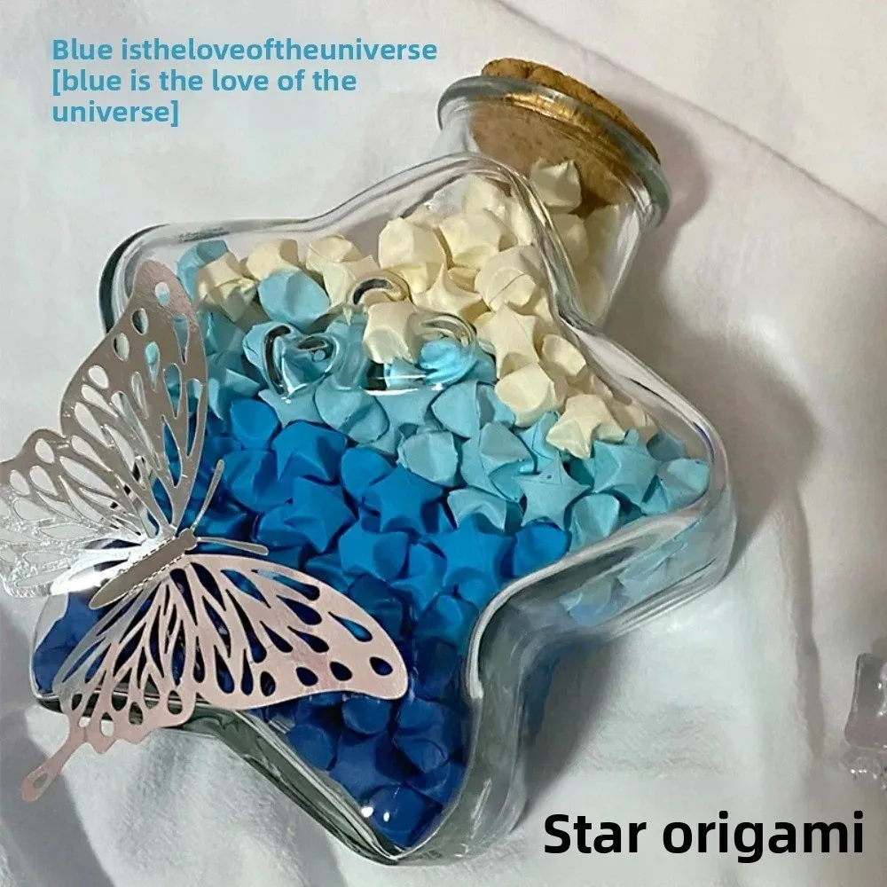 

Набор для творчества: Стеклянная бутылка с звездами-оригами и светящимися гирляндами, бумажные полоски для звезд, радужные цвета