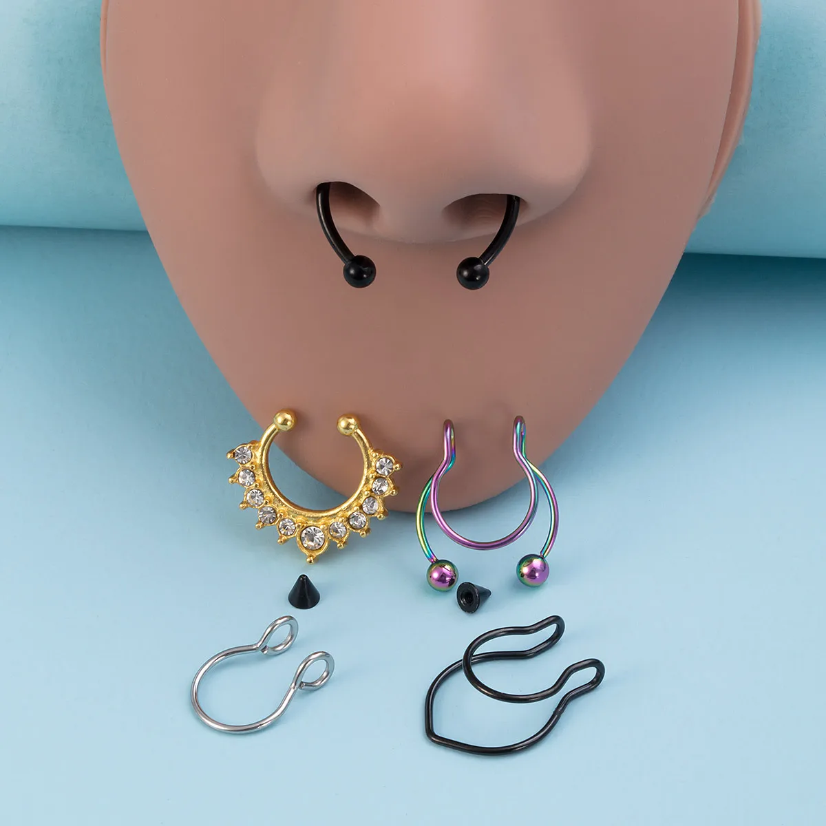 ¡Prueba la mirada del setto! Anillo de nariz falso de acero inoxidable ajustable, joyería nasal ovalada no perforada sin compromiso.