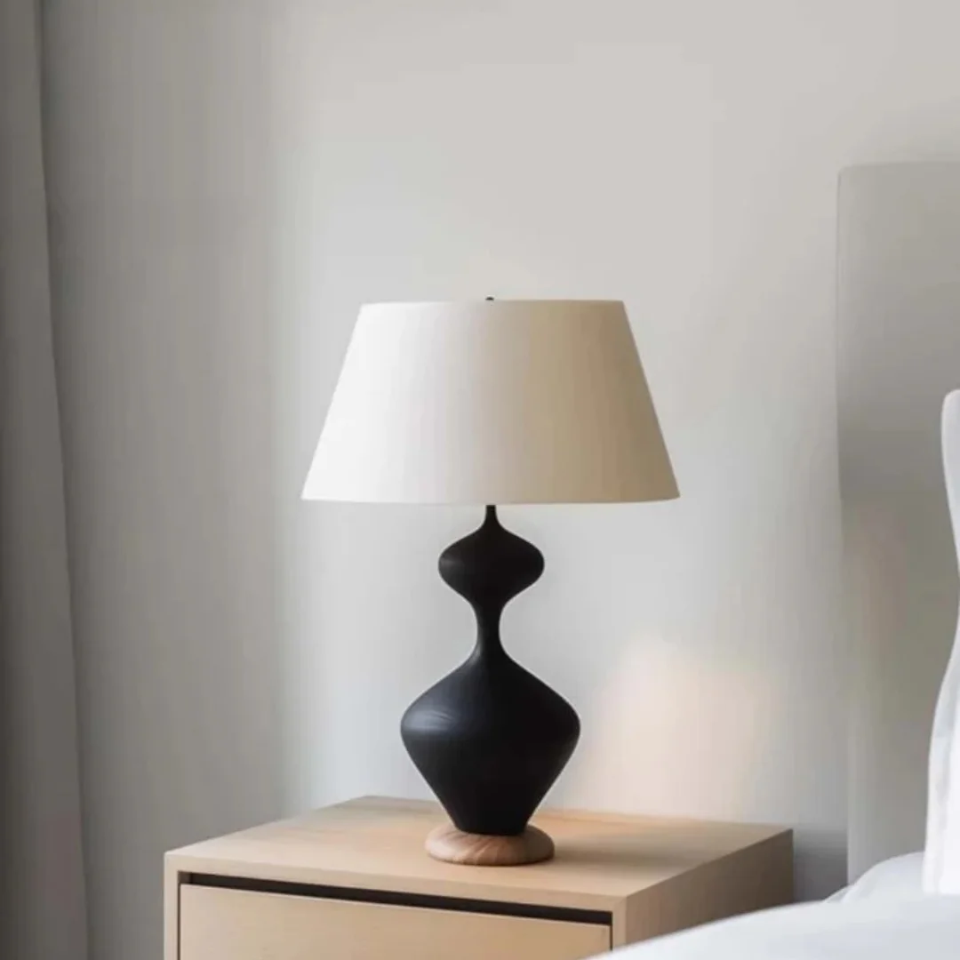 A Matte Black Double-cylinder-shaped Hand-carved Wooden Handicraft Suitable As A Decorative Wooden Gift For The Living Room